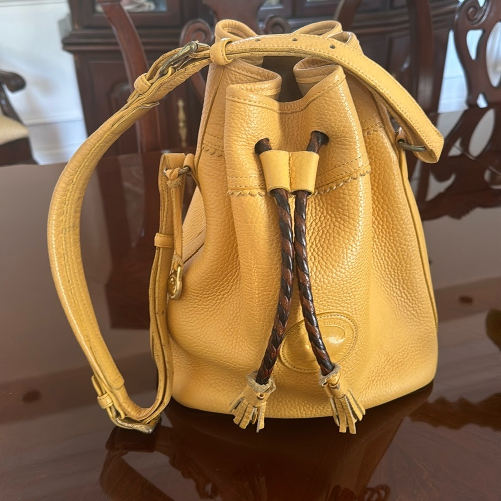 Dooney Burke drawstring handbag in gold